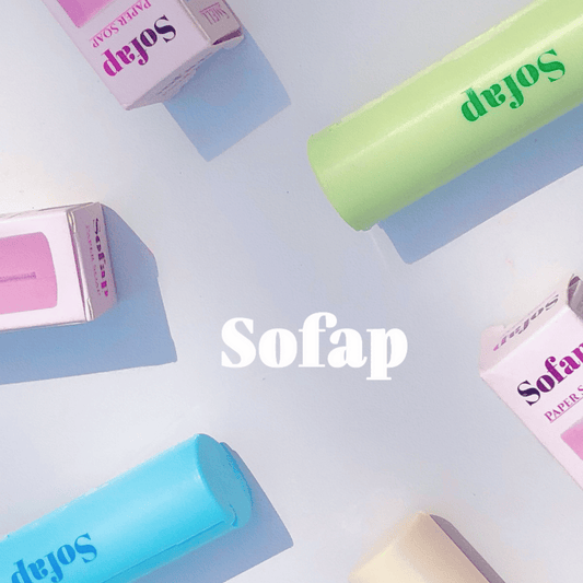 A collection of Sofap soaps in various colors, including pink, green, blue, and yellow, arranged in a visually appealing manner with the brand name 'Sofap' prominently displayed.